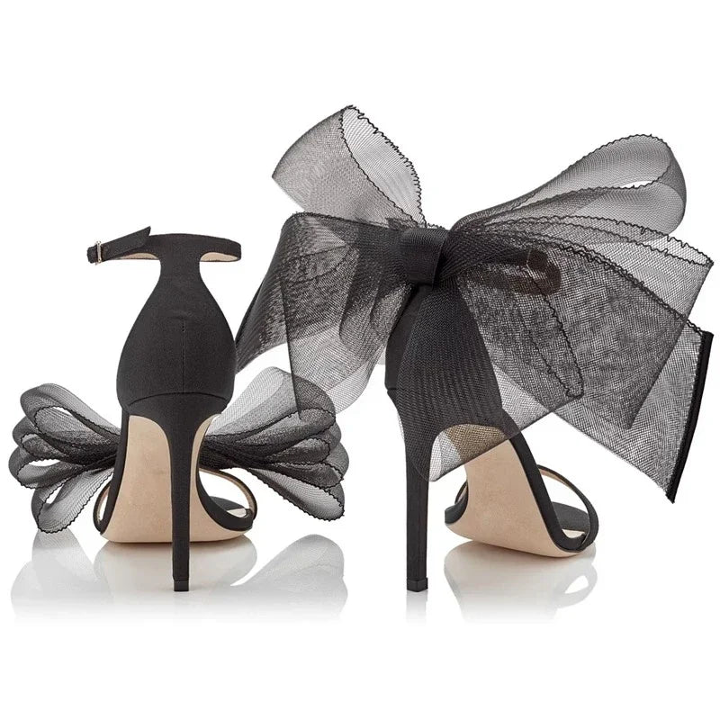 Lace bow heels Asymmetrical design stiletto heels.